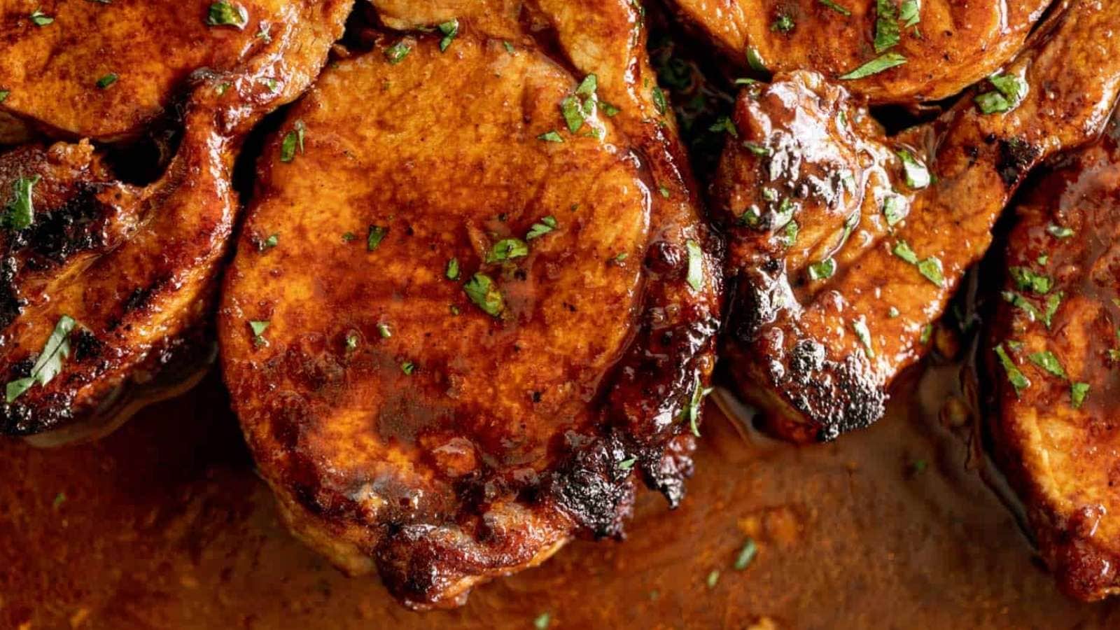 Bbq pork chops on a baking sheet.
