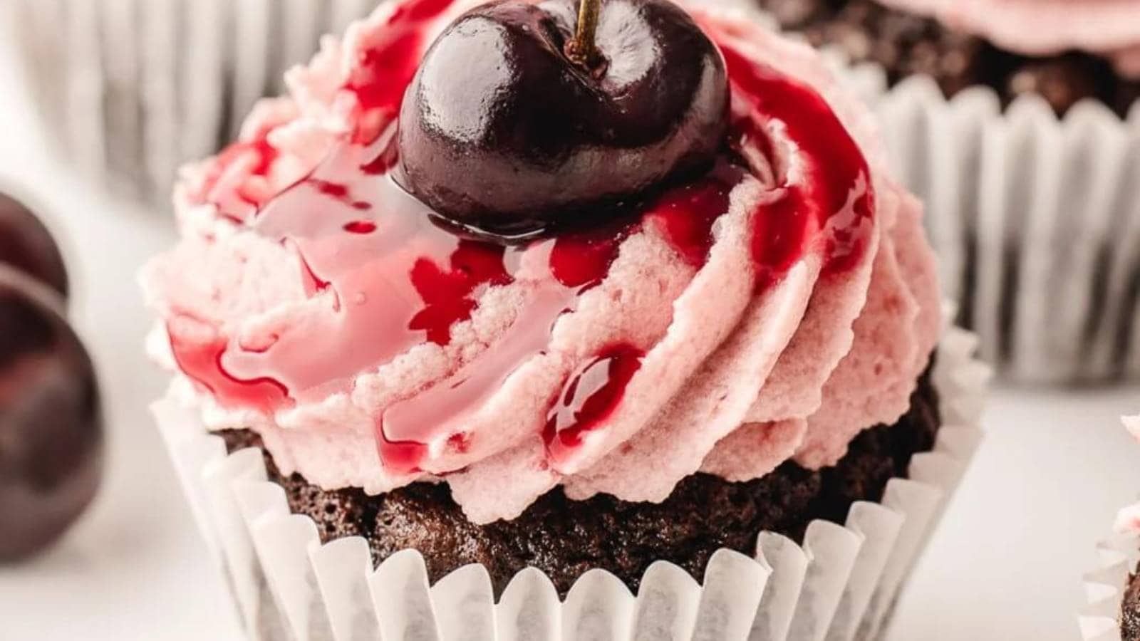 A cupcake with a cherry on top.