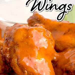 Air fryer frozen chicken wings on a plate.
