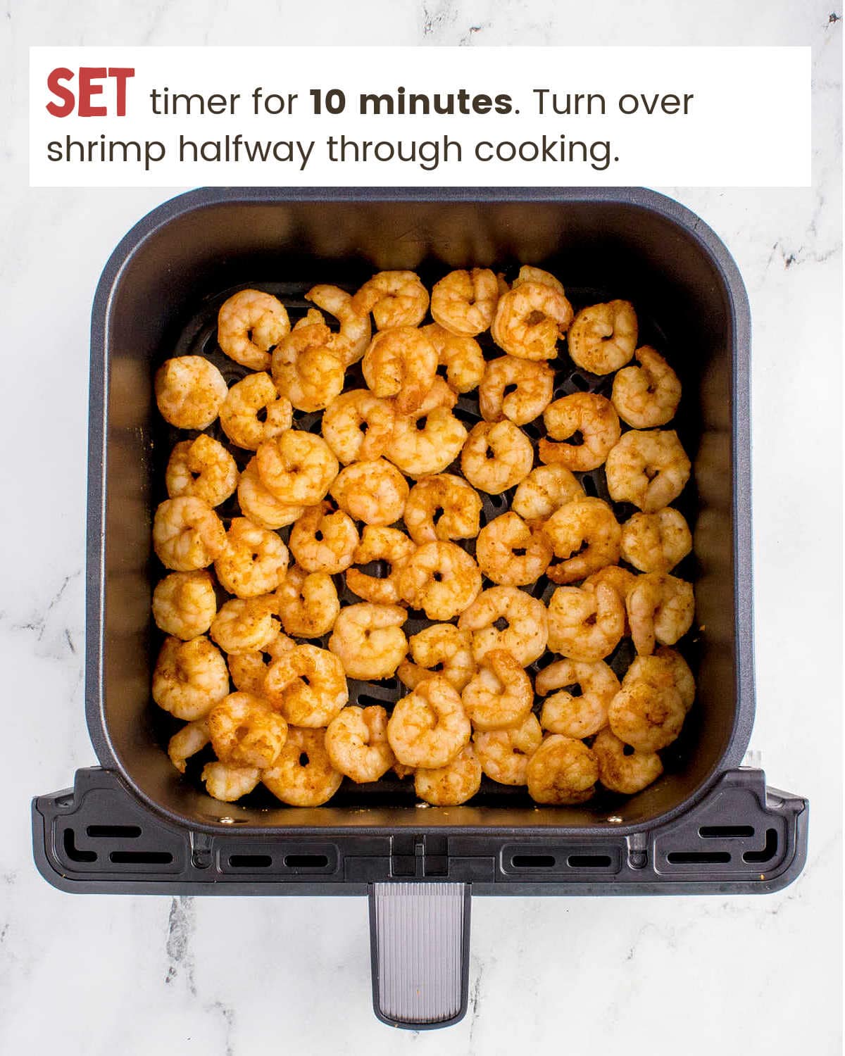A cooked shrimp in an air fryer.