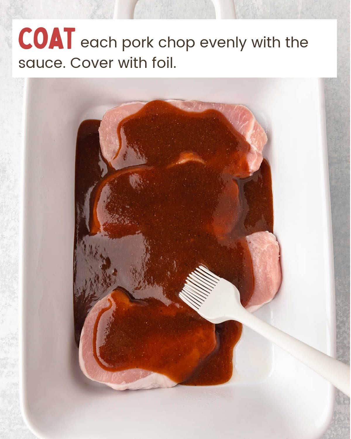 A dish with pork chops covered in bbq sauce and a fork.