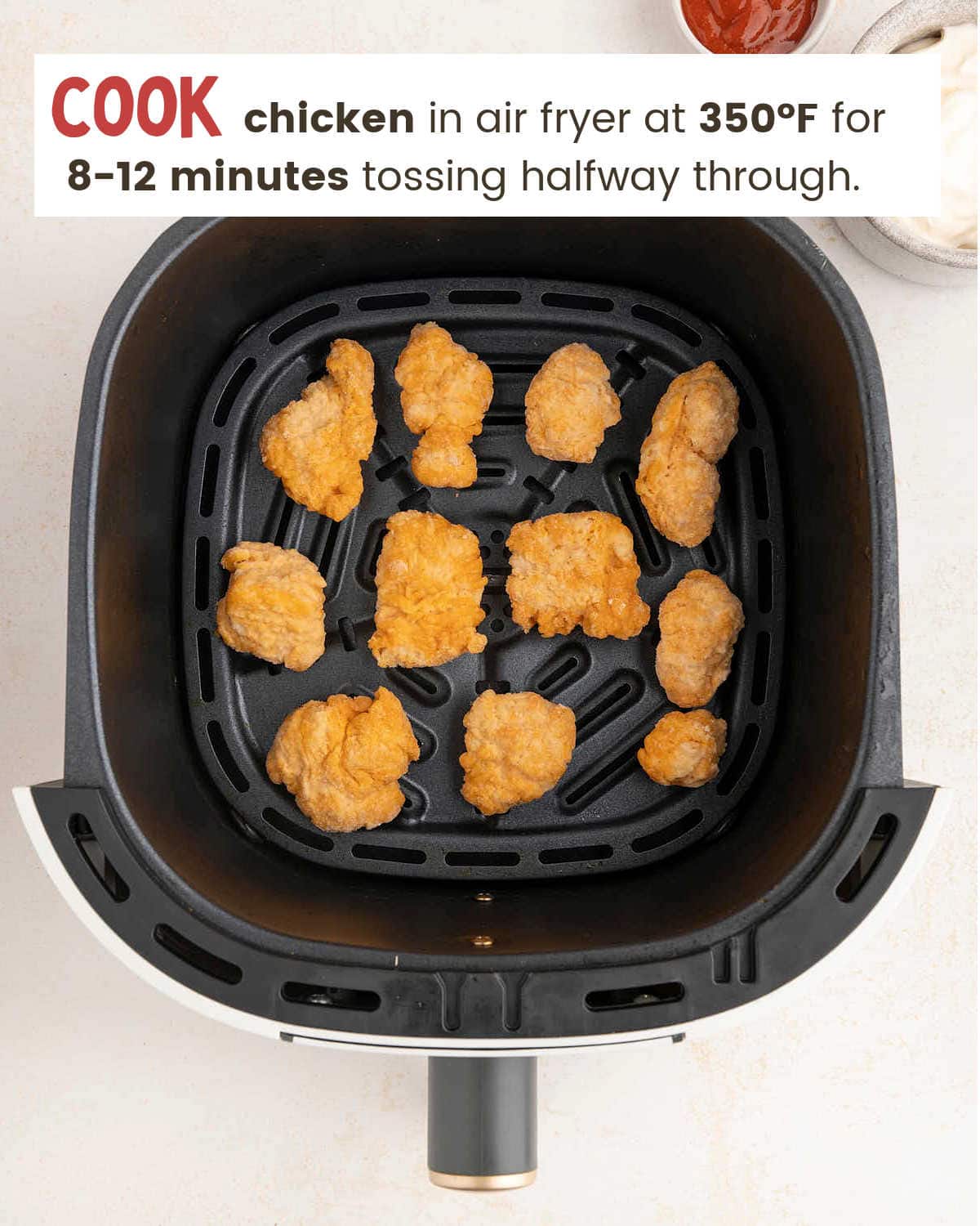 An air fryer with chicken in it for Bang Bang Chicken