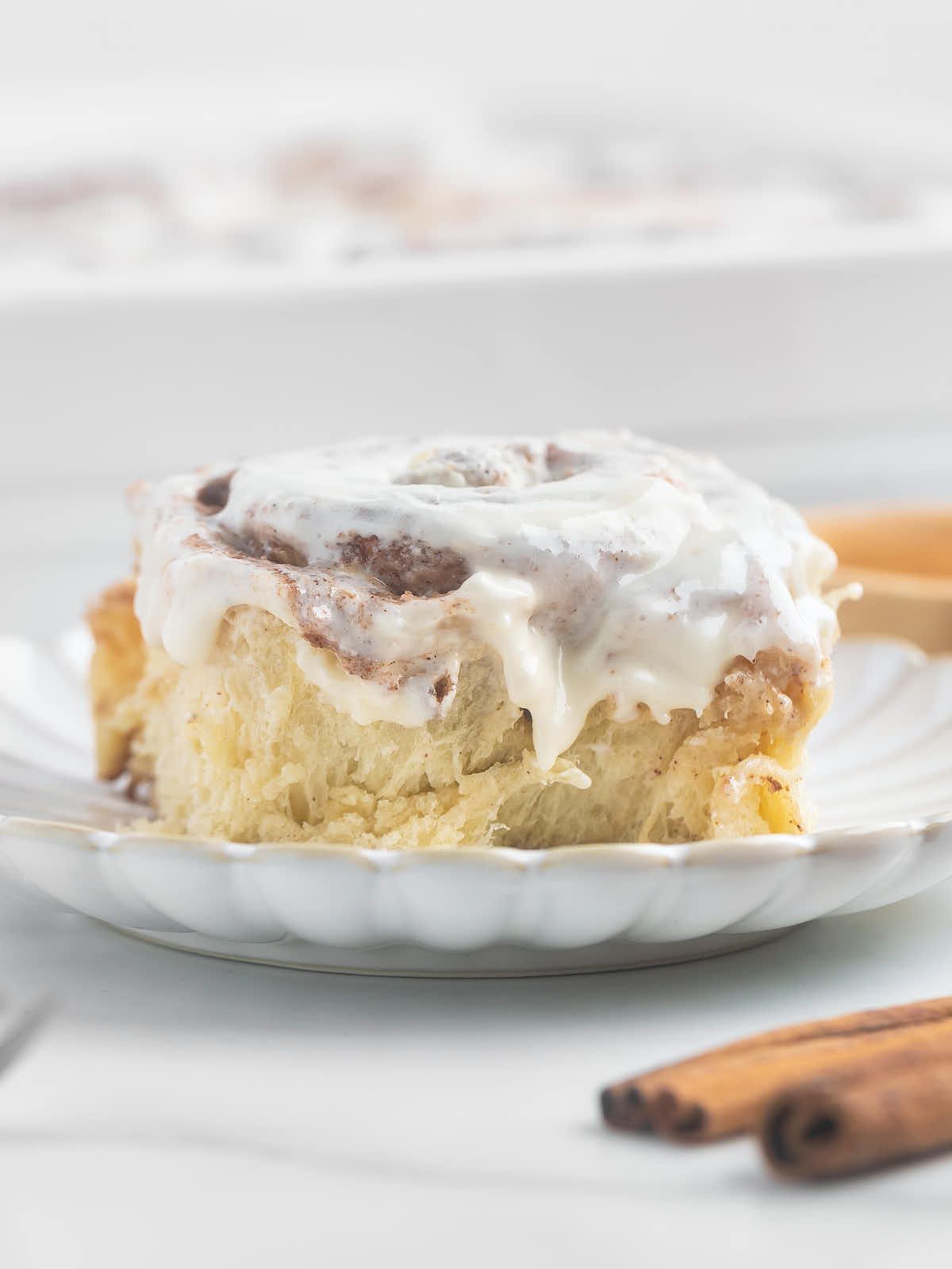 A close-up of an easy homemade Cinnamon Rolls on a plate.
