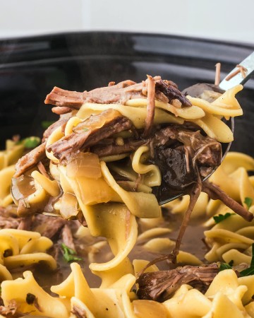 A spoonful of Crock Pot beef and noodles.