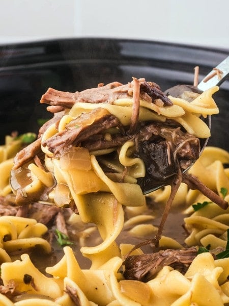 A spoonful of Crock Pot beef and noodles.