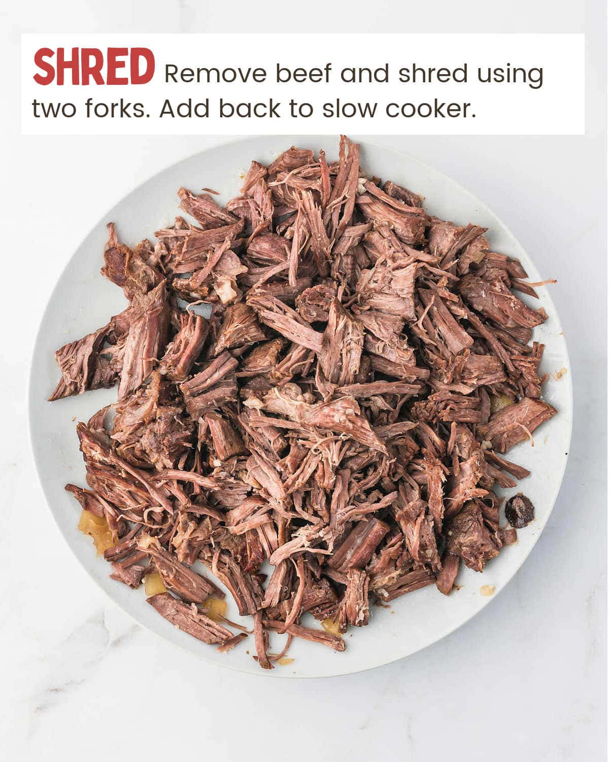 A bowl of shredded beef for Crock-Pot Beef and Noodles