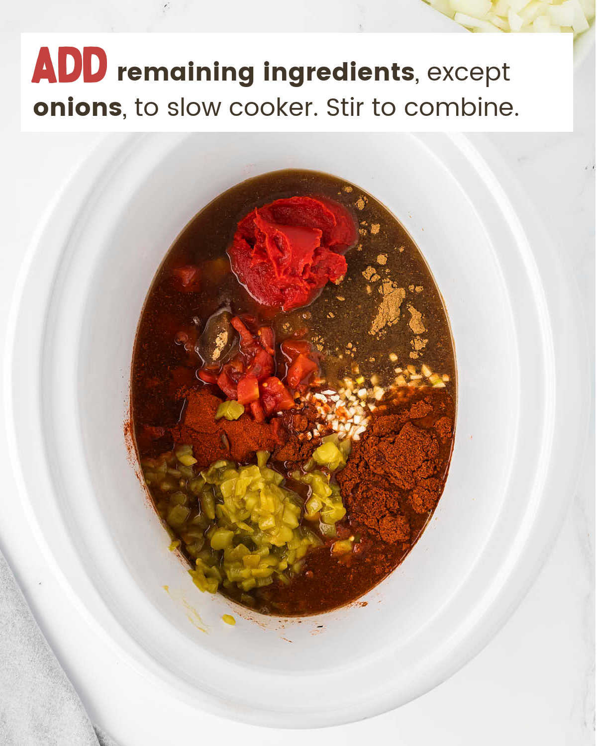 A slow cooker with ingredients for No Bean Chili