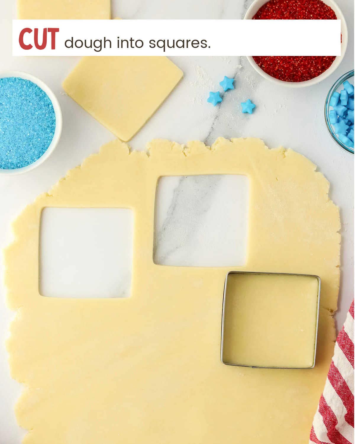 Cut dough into squares for Fourth of July Pinwheel Cookies