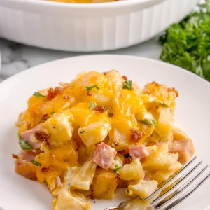 Ham and Potato Casserole on a plate with a fork.