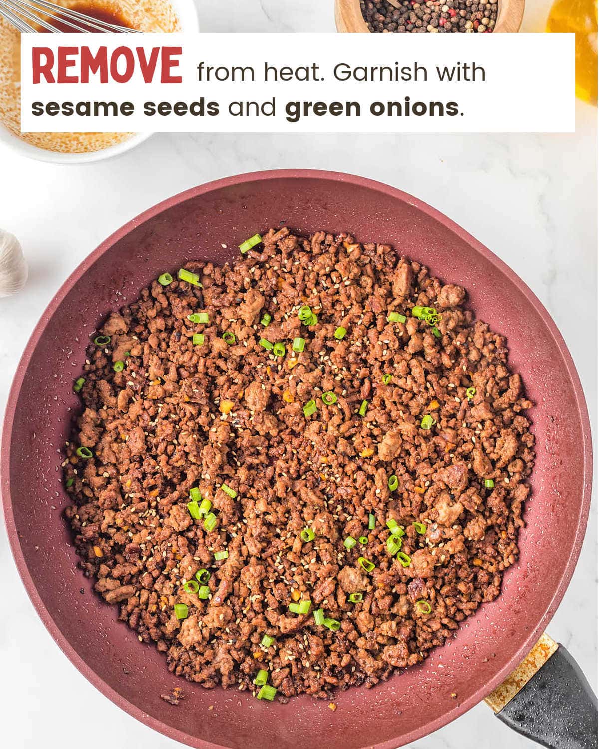 Garnish with sesame seeds and green onions for Korean Beef Bowl