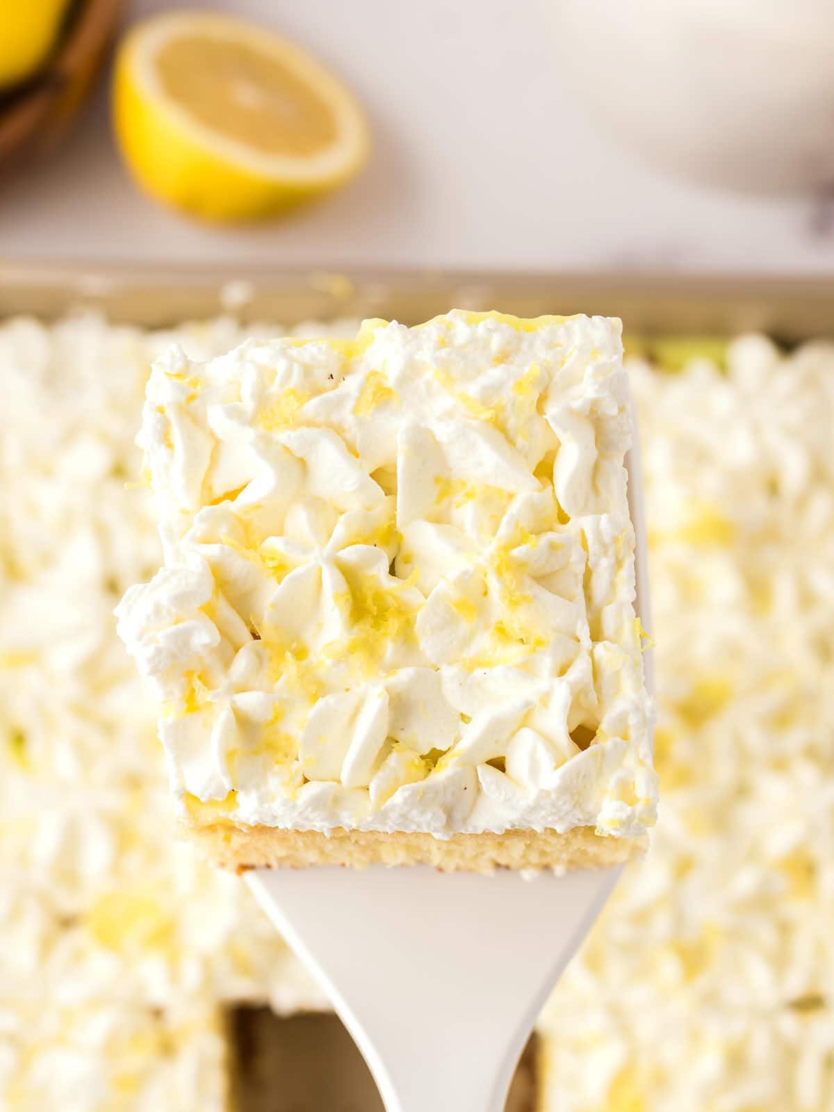 A cake with whipped cream on top.