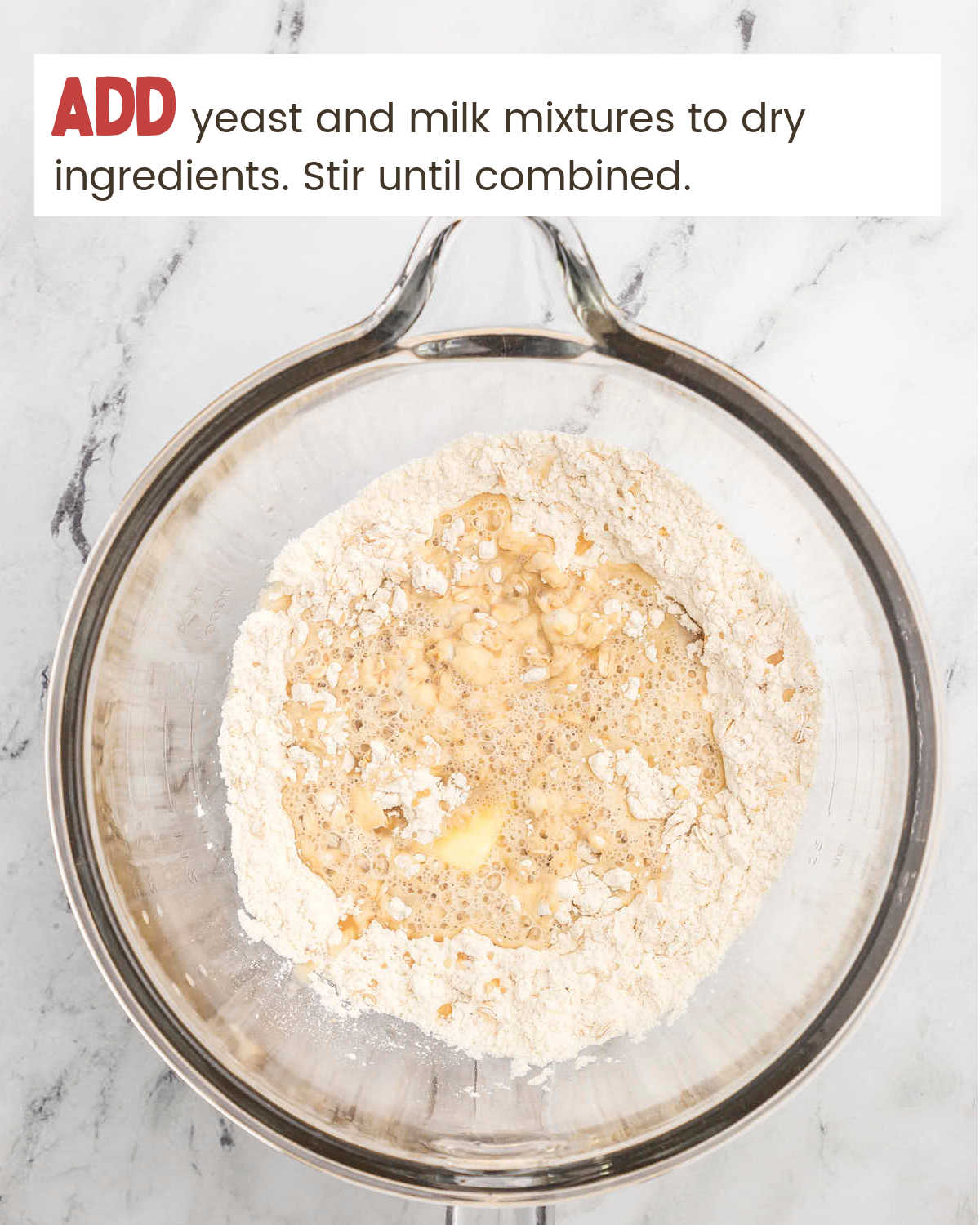 Adding wet ingredients to dry ingredients for Oatmeal Dinner Rolls