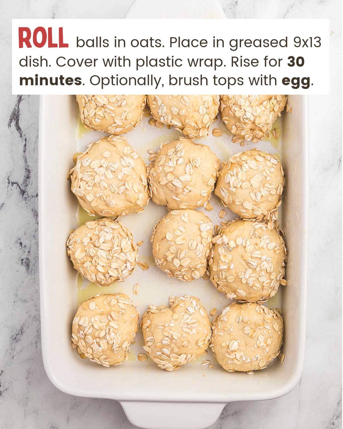 Coat Oatmeal Dinner Rolls in oats in a baking dish.