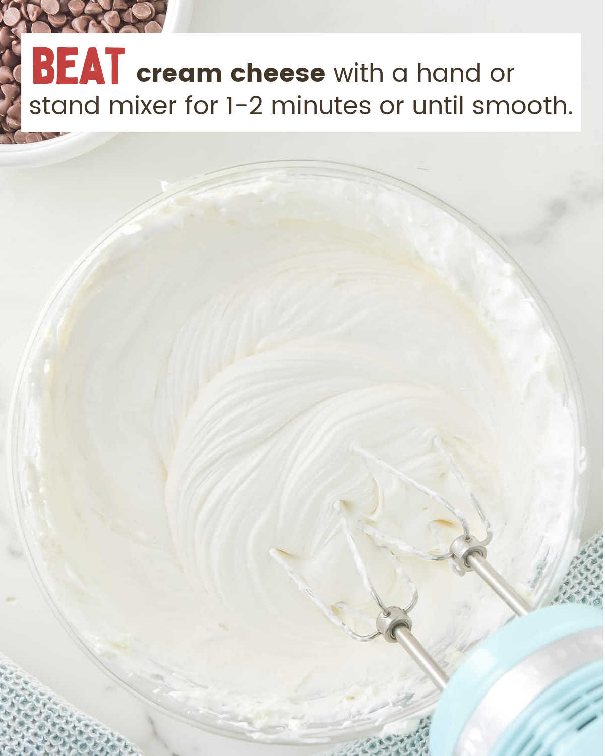 Mixing cream cheese to a smooth consistency for Pink Booty Dip