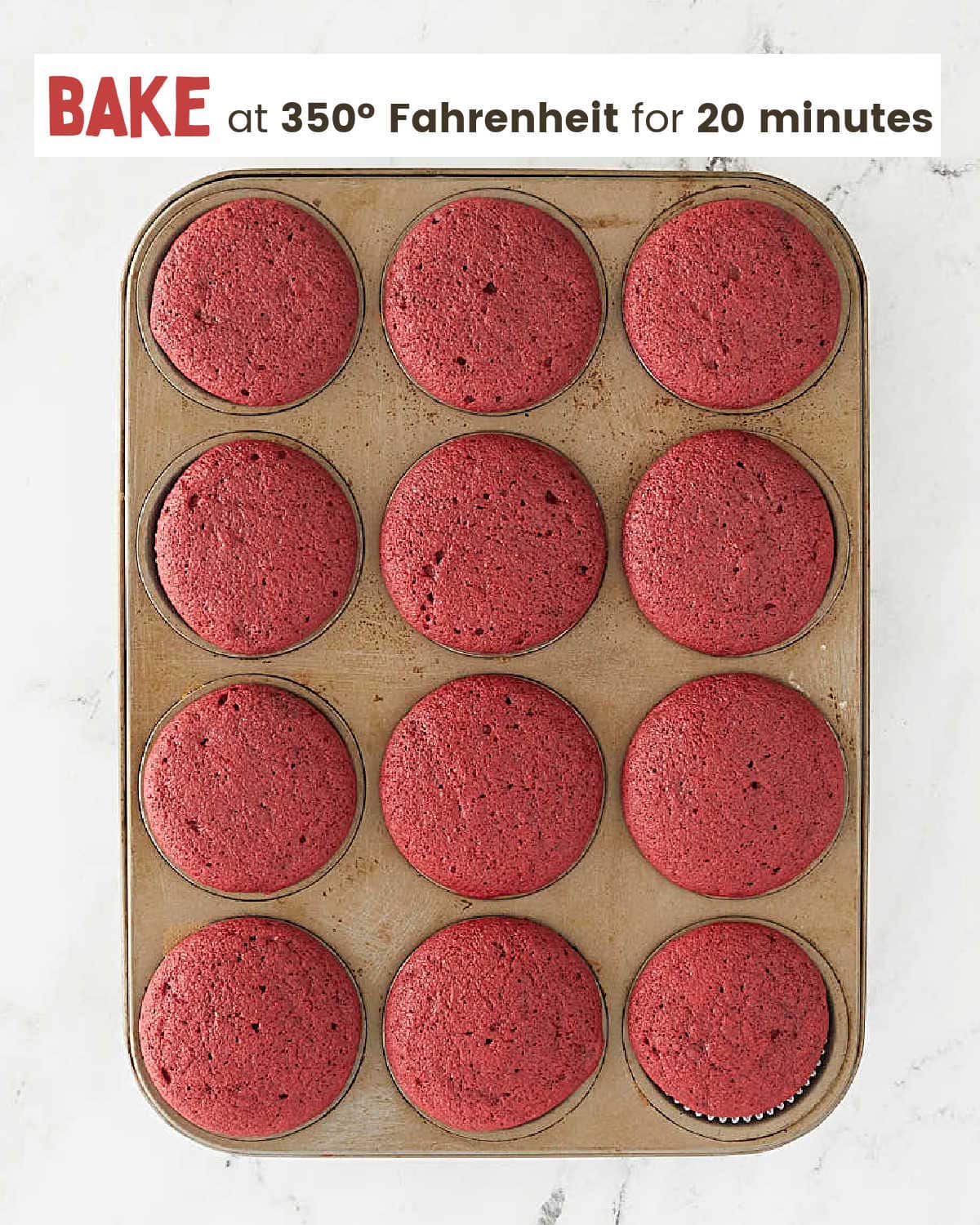 A baking tray with red cupcakes.