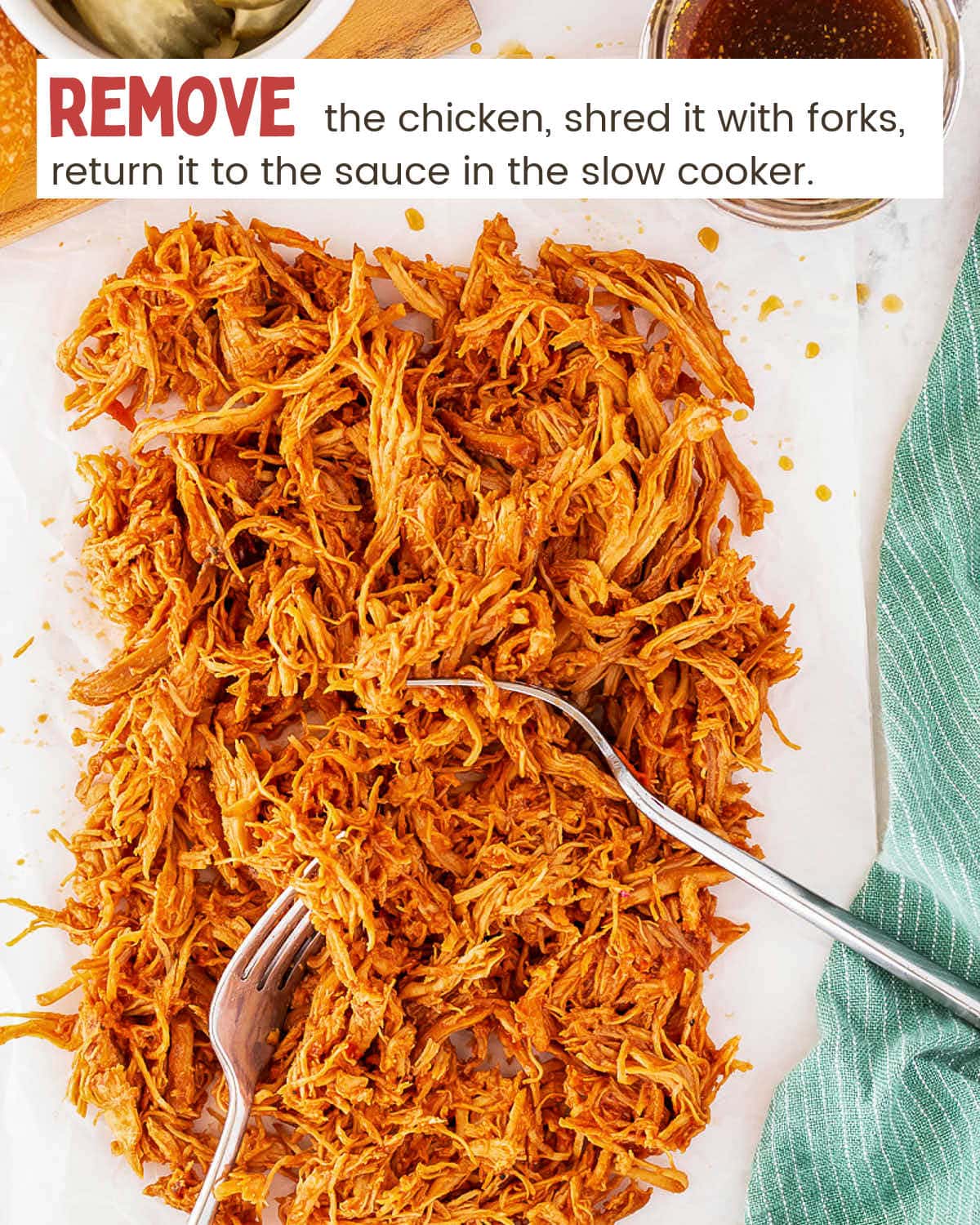 Slow Cooker Pulled Chicken on a plate with a fork.