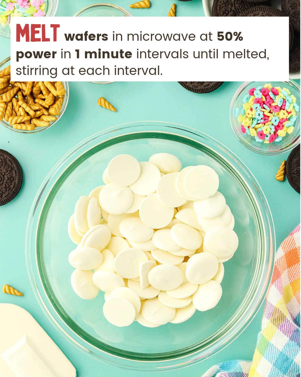 White chocolate wafers in bowl for Unicorn Oreo Pops