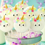 Unicorn Cake Pops in a decorated party bucket.