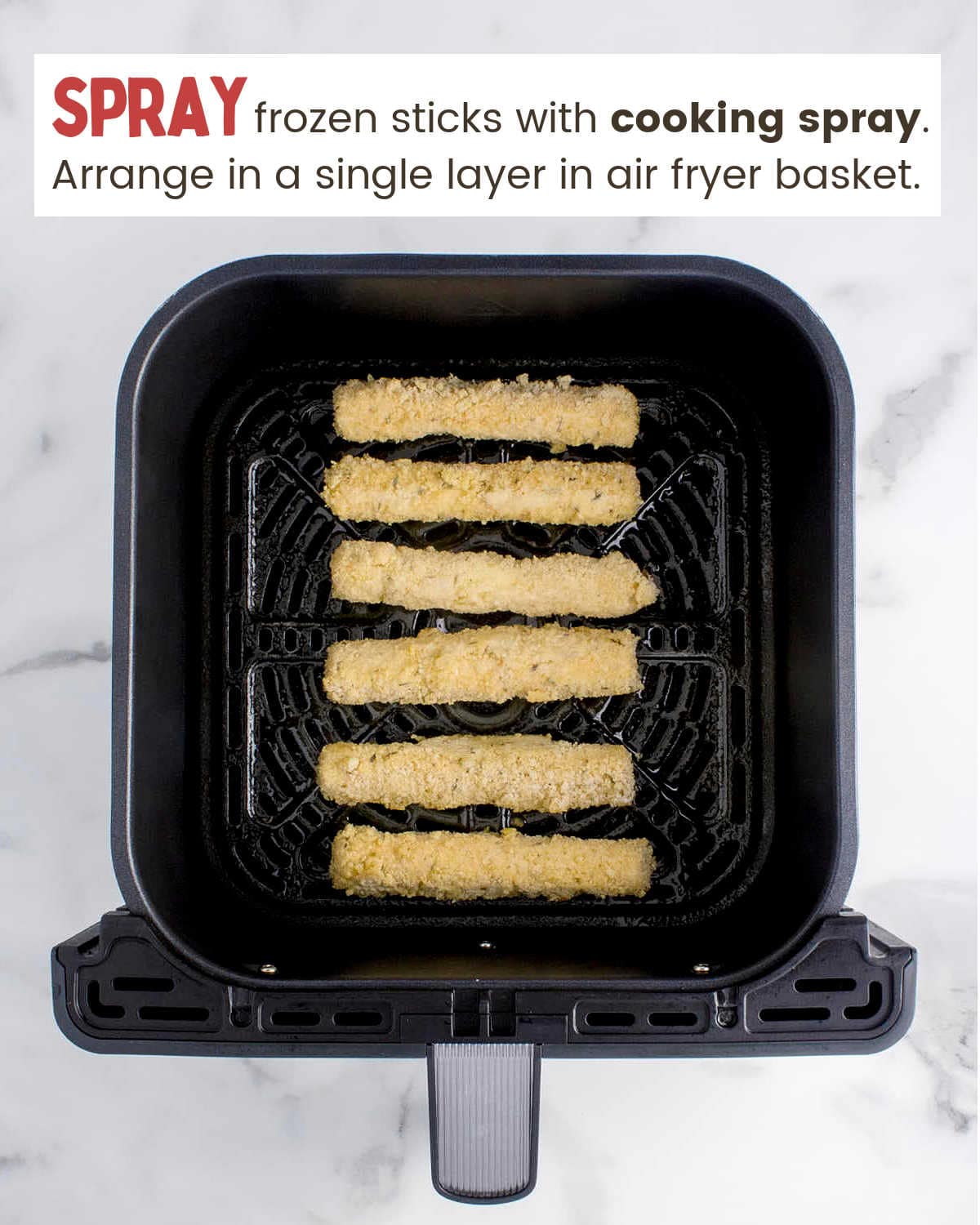 Layered Air Fryer Mozzarella Sticks in air fryer basket.