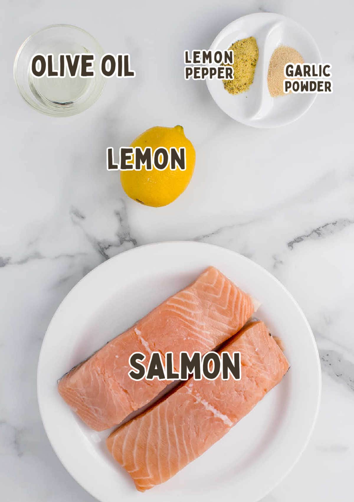 Ingredients for Air Fryer Lemon Pepper Salmon on a marble countertop.
