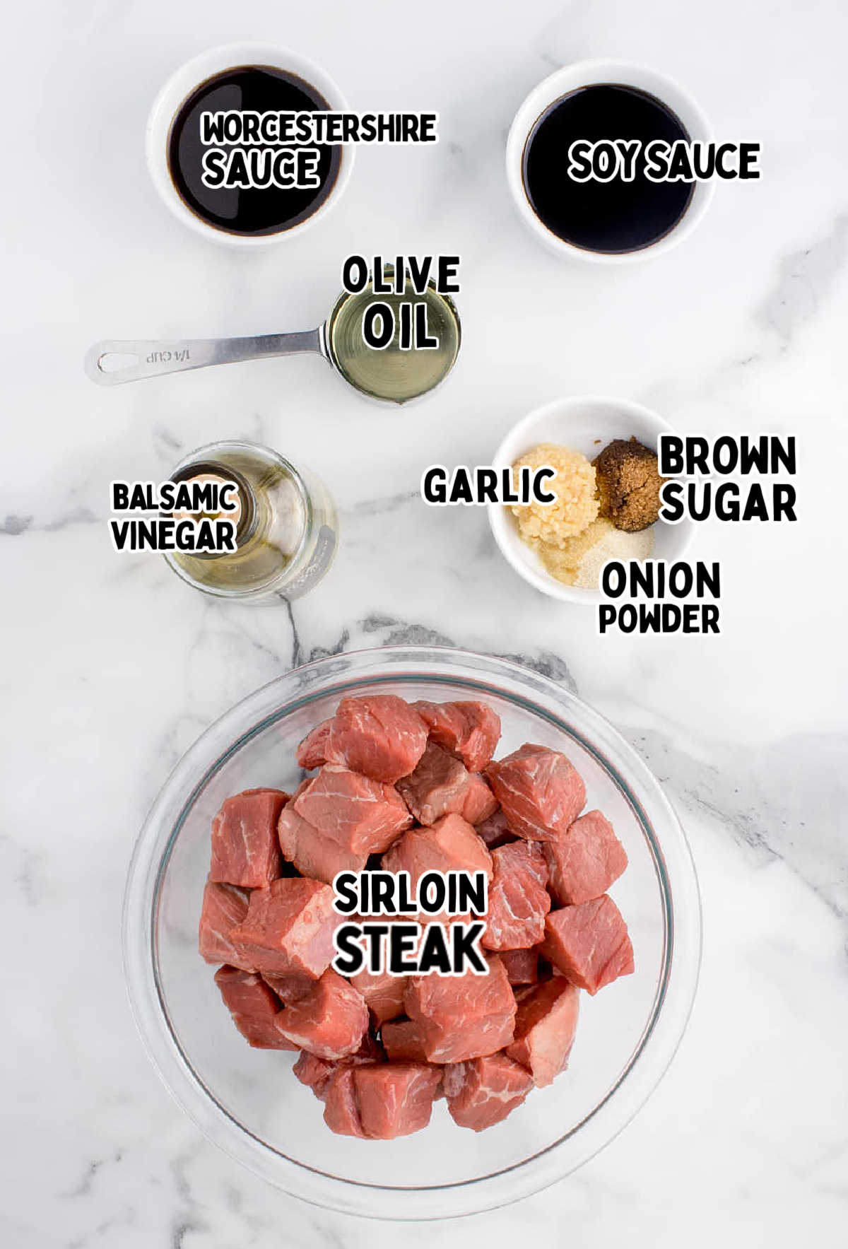 Ingredients for Air Fryer Steak Bites on marble countertop.
