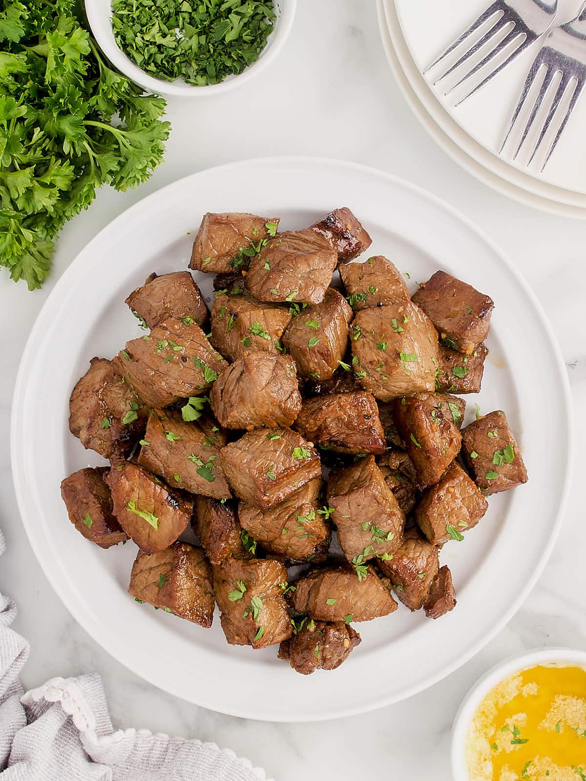 Top-down view of a plate of steak bites.