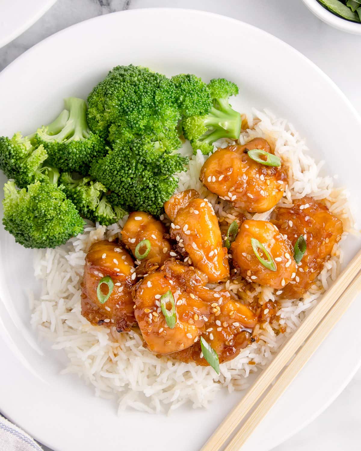 Air Fryer Teriyaki Chicken served over rice with steamed broccoli.
