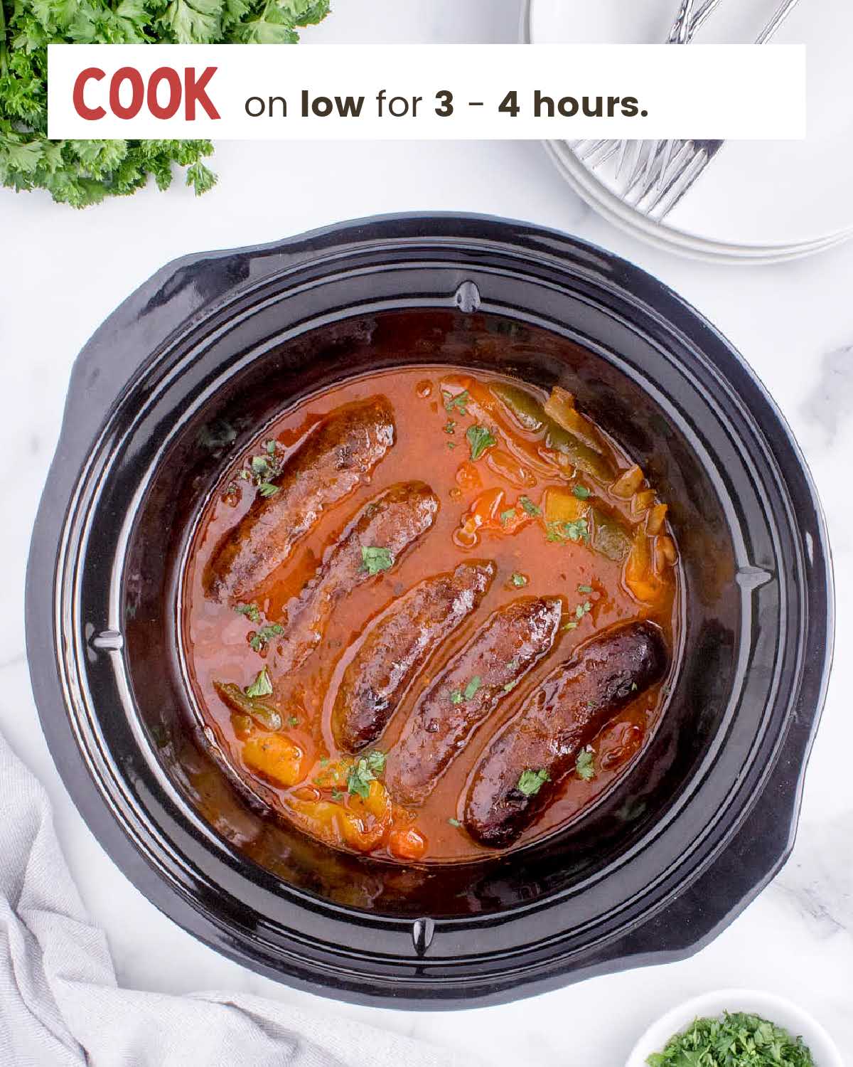 Cooked sausages and peppers in a crockpot.