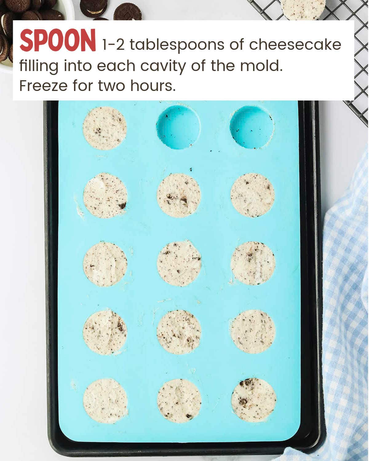 Frozen Oreo Cheesecake Bites in a silicone mold.