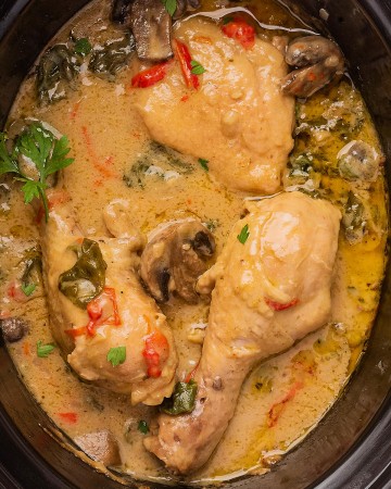 Creamy Chicken and Mushrooms in a creamy sauce in a Crock Pot.