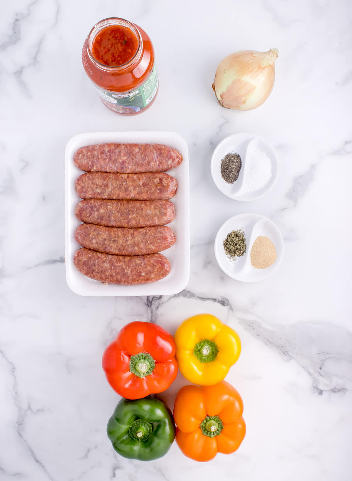 Ingredients needed to make Crockpot Sausage and Peppers.