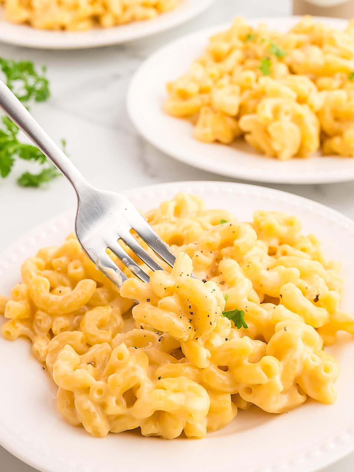 Closeup of Gouda Mac and Cheese served on a white plate.