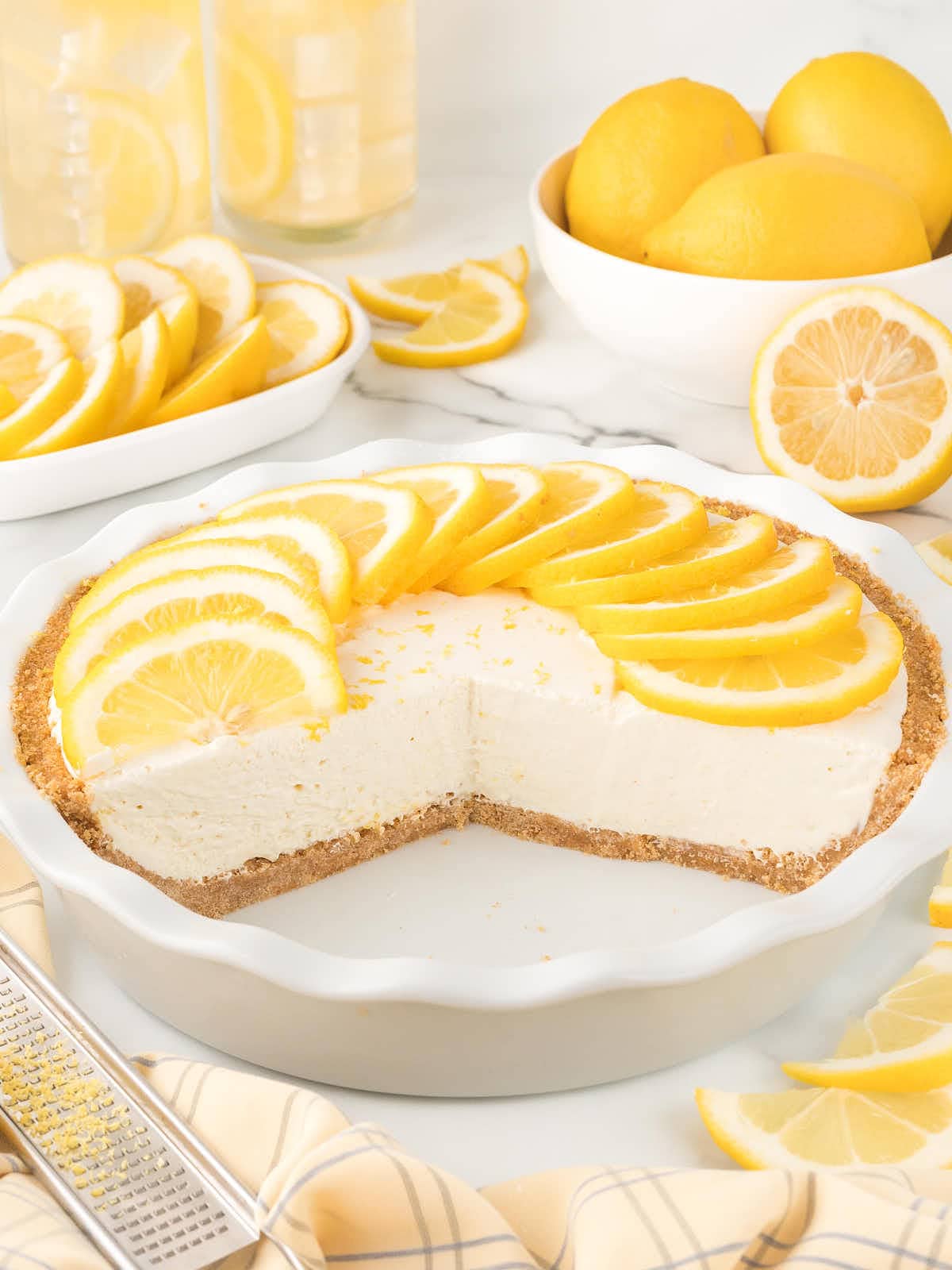 A white cake pan with a no-bake lemon icebox cake