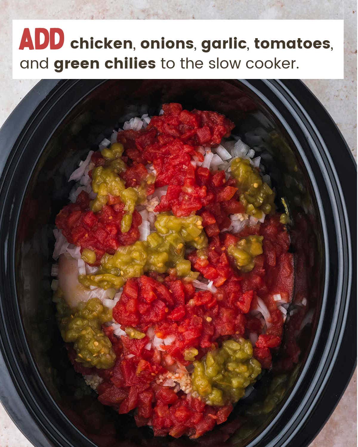 Adding chicken and veggies to crock-pot for Slow Cooker Chicken Enchilada Casserole.