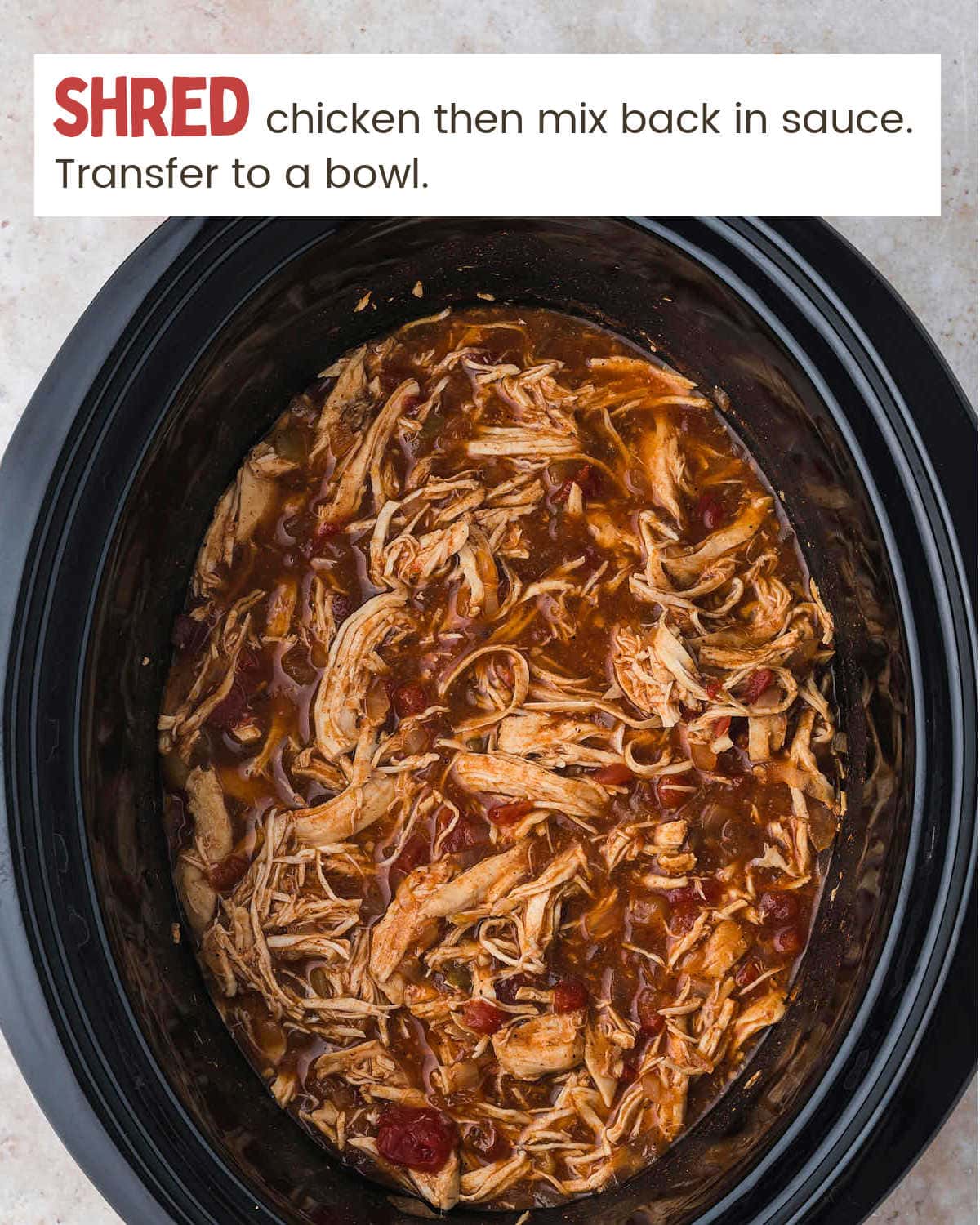 Shredded chicken for Slow Cooker Chicken Enchilada Casserole in crock-pot.