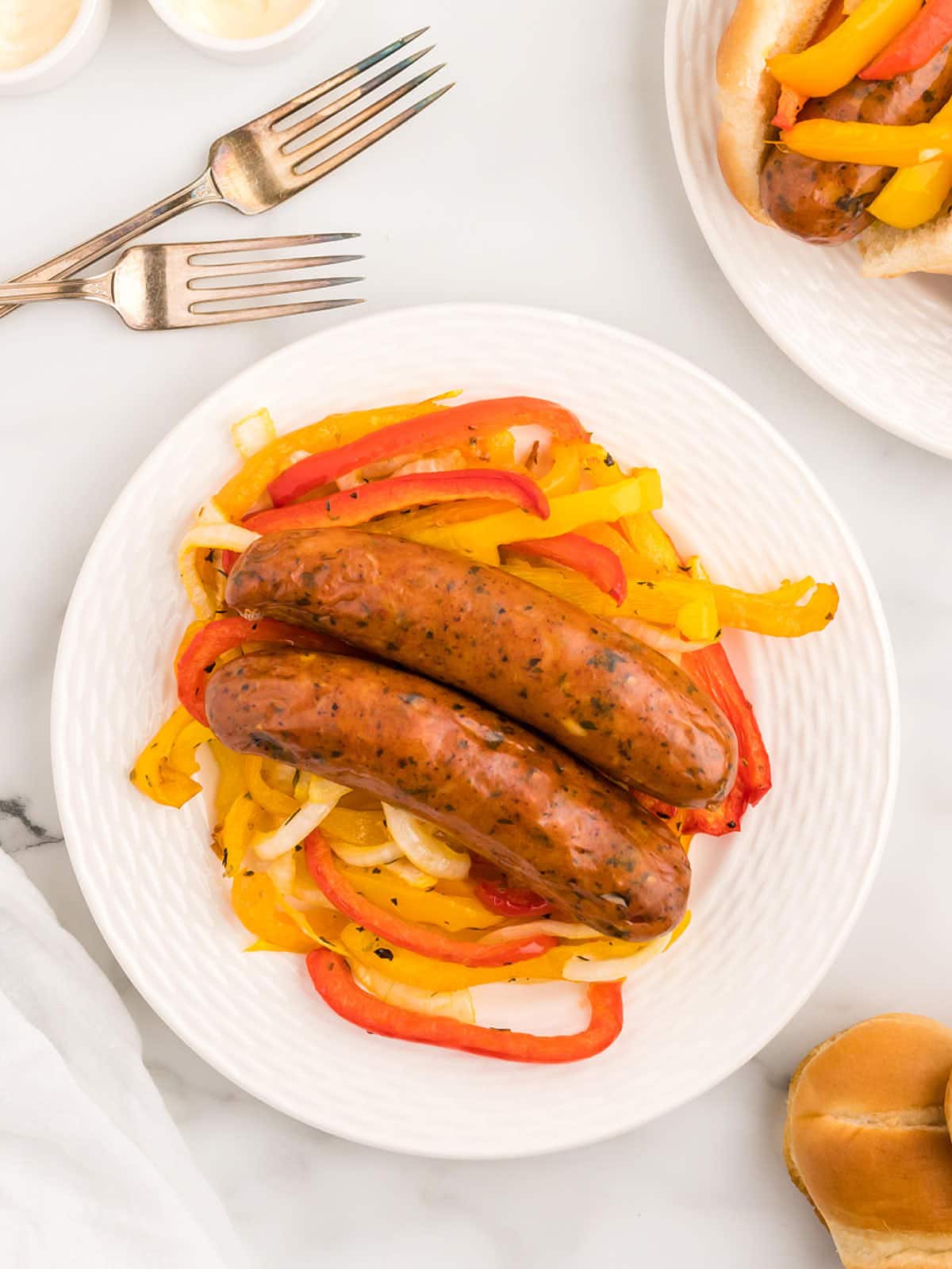 Topdown view of two Air Fryer Chicken Sausage with Peppers.