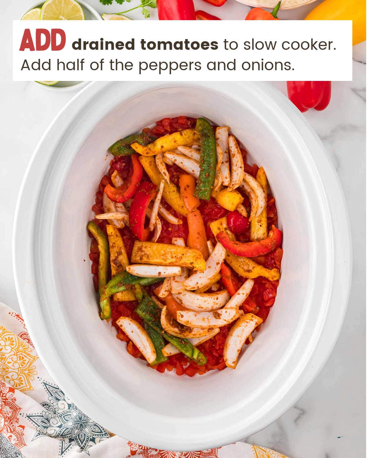 Adding veggies to slow cooker for Crockpot Chicken Fajitas.