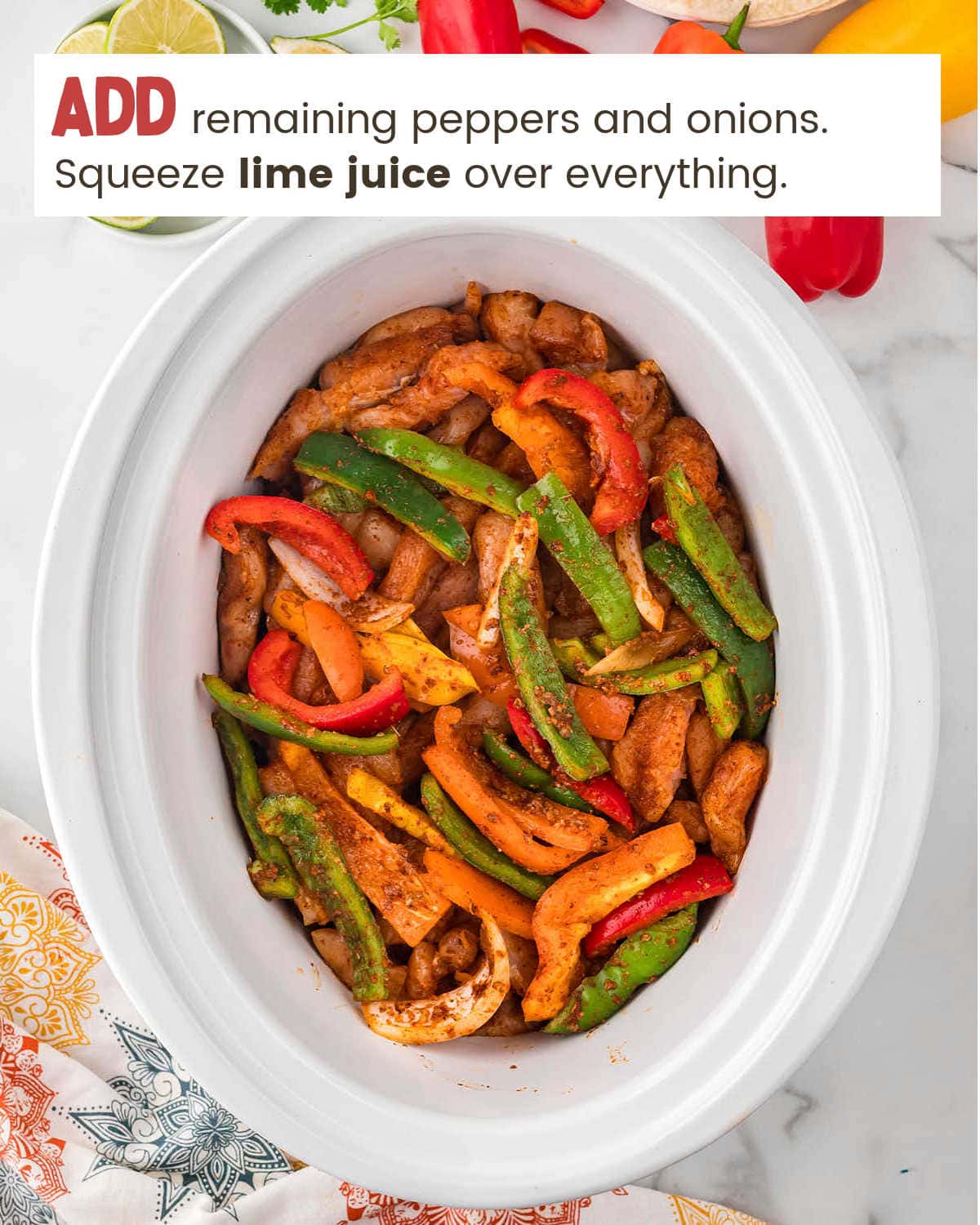 Mixing chicken and veggies in slow cooker for Crockpot Chicken Fajitas.