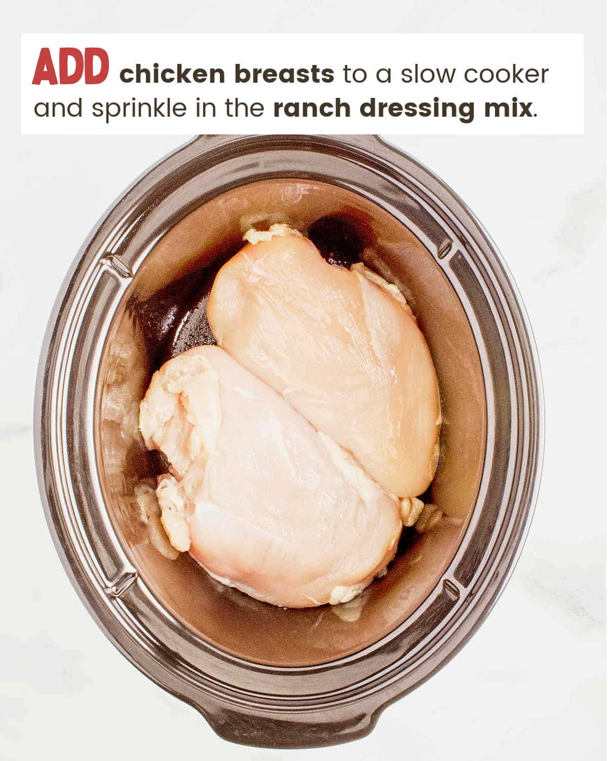 Chicken breasts in a slow cooker for Crockpot Crack Chicken.