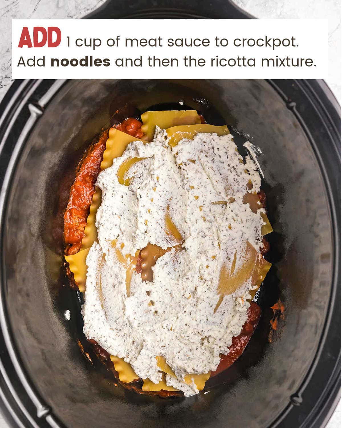 Layering ingredients in slow cooker for Crockpot Lasagna.