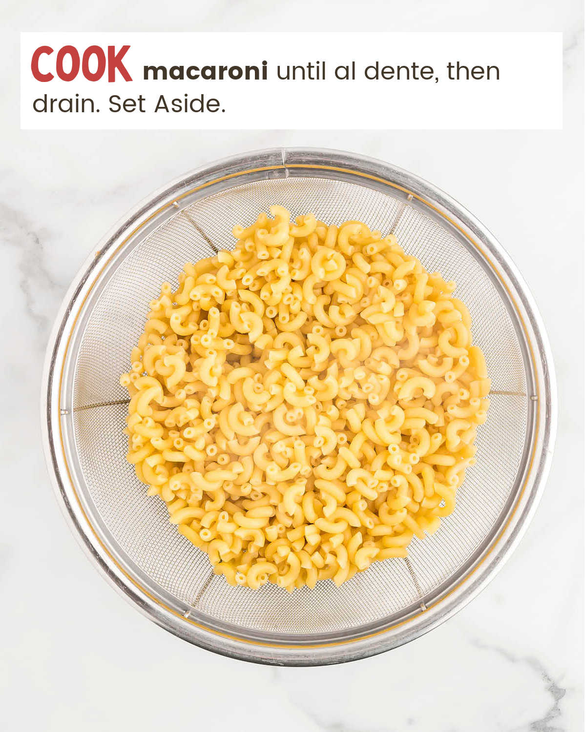 Cooked elbow macaroni in a glass bowl for Gouda Mac & Cheese.