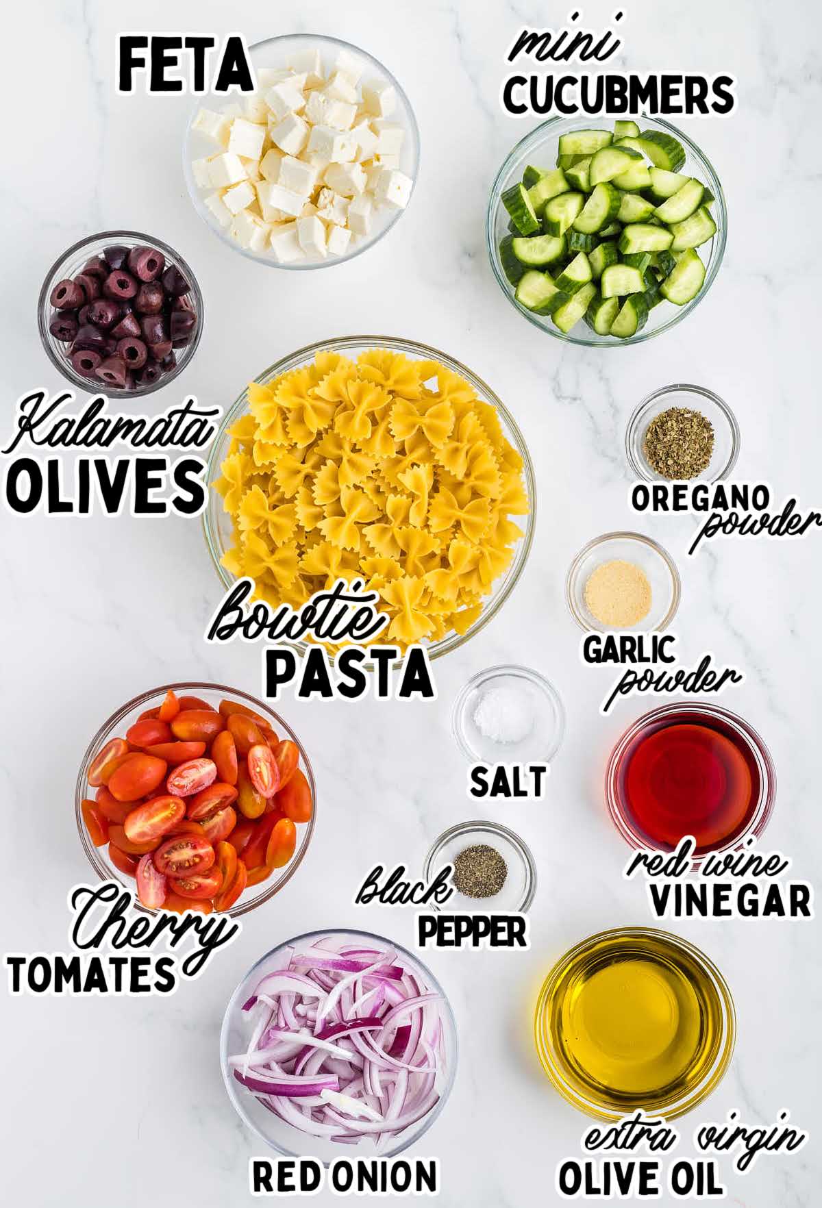 Ingredients need to make a Greek Pasta Salad.