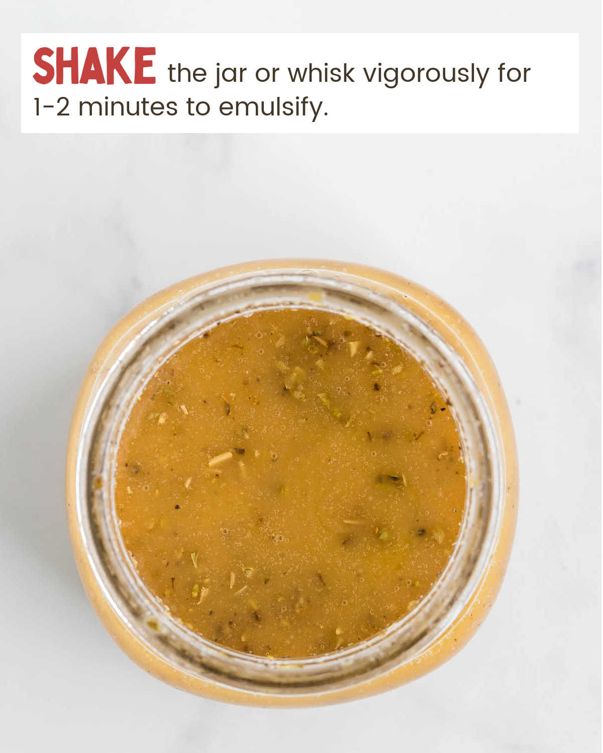 Greek Pasta Salad dressing in a mason jar.