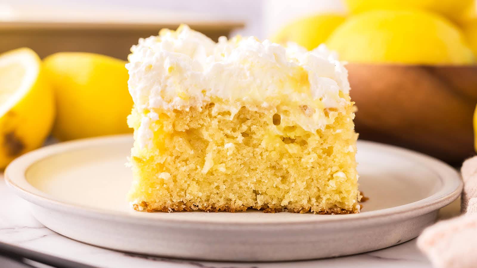 Lemon Poke Cake recipe by Cheerful Cook.