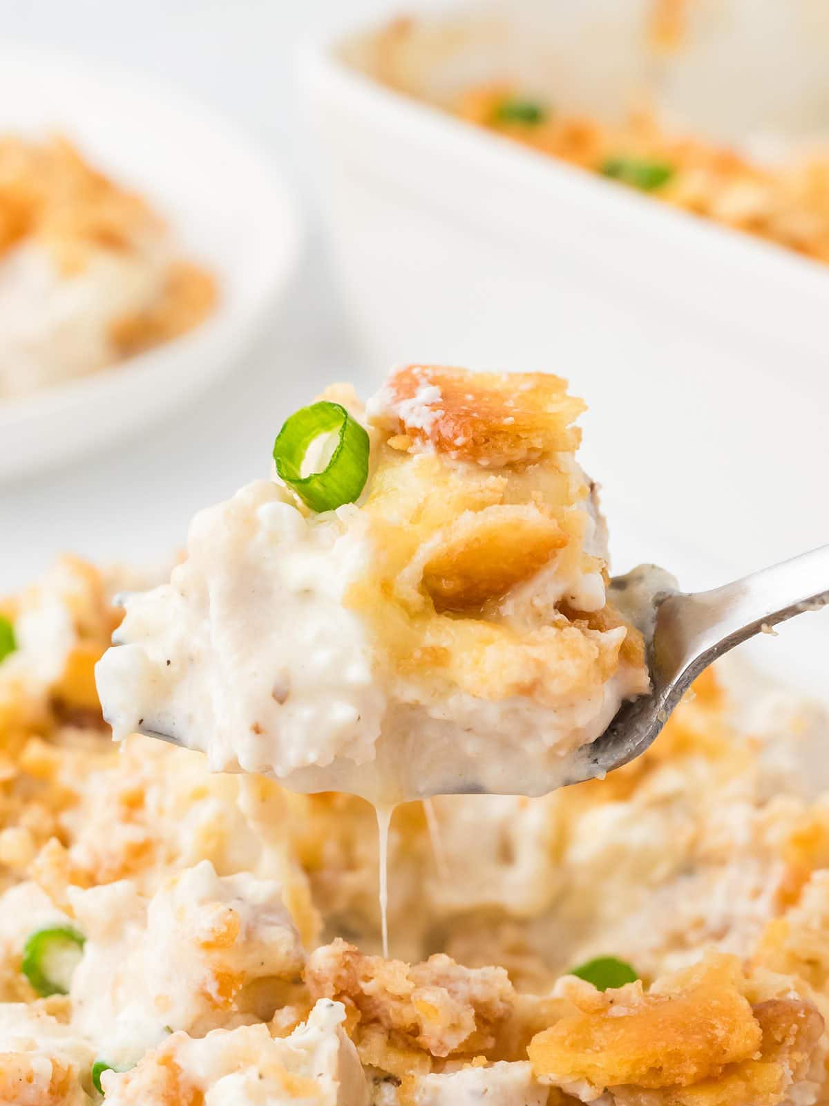 A spoonful with Million Dollar Chicken Casserole.
