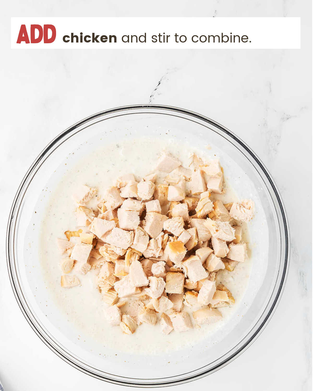 Adding chicken to creamy sauce for Million Dollar Chicken Casserole.