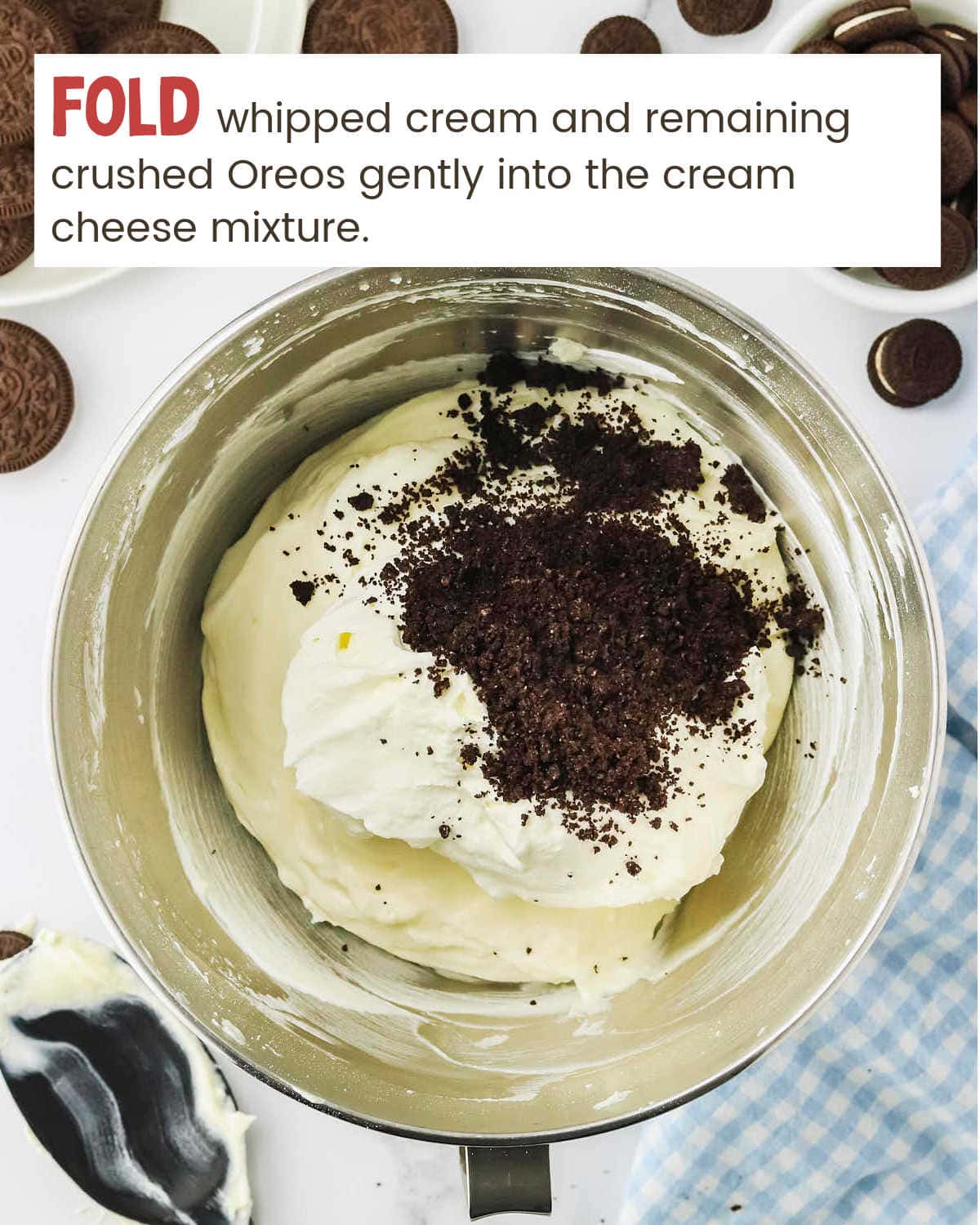 Folding whipped cream into cream cheese mixture for Oreo Cheesecake Bites.