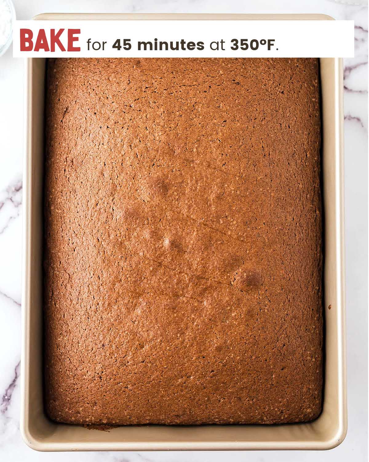 Baked cake in dish for Oreo Sheet Cake.