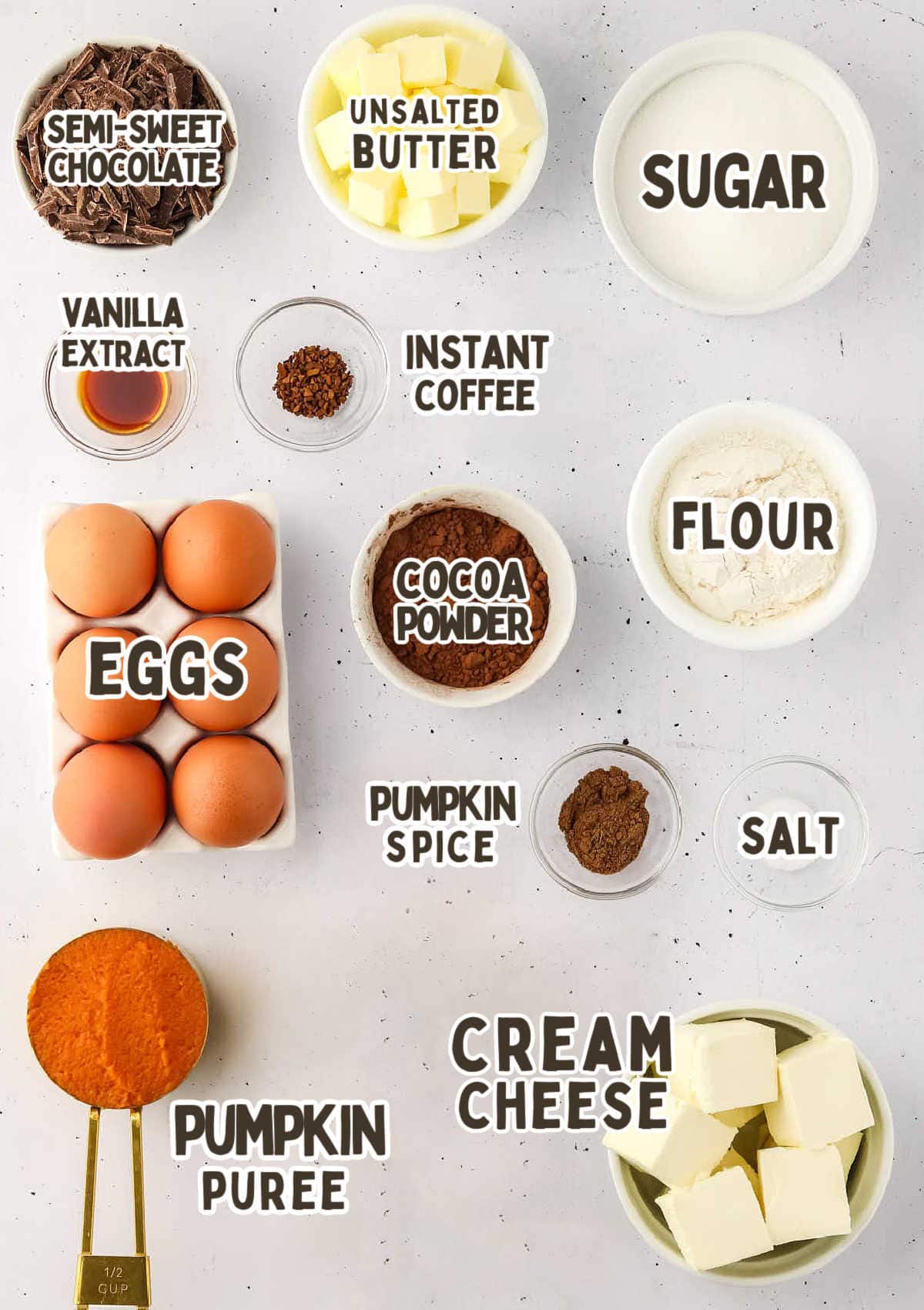 Ingredients for Pumpkin Cheesecake Brownies on a countertop.