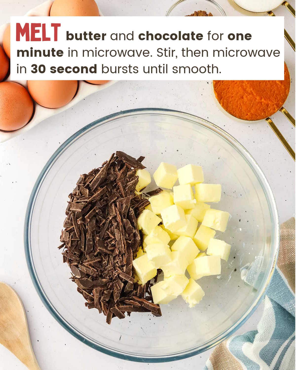 Butter and chocolate in a bowl for Pumpkin Cheesecake Brownies.